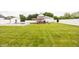 Large backyard with grass and a white fence, with a swimming pool and barn at 7895 E 175 N, Franklin, IN 46131