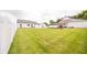 Large backyard with grass and a white fence, a swimming pool, and a barn at 7895 E 175 N, Franklin, IN 46131