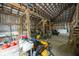 Barn interior with lawn equipment and a white spray tank at 7895 E 175 N, Franklin, IN 46131