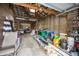 Barn interior with shelves, lawn chairs, ladders, and other storage items at 7895 E 175 N, Franklin, IN 46131