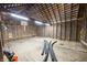 Empty barn interior with wooden walls, exposed beams and rafters at 7895 E 175 N, Franklin, IN 46131