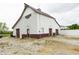 White barn with garage and normal doors on a gravel lot at 7895 E 175 N, Franklin, IN 46131