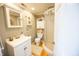 This cozy bathroom includes a white vanity, shower, and charming decorative elements at 7895 E 175 N, Franklin, IN 46131