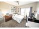 This bright bedroom boasts natural light, carpeted floors, and fun decorative elements at 7895 E 175 N, Franklin, IN 46131