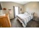 This cozy bedroom boasts carpeted floors, a warm color palette, and is well-lit by natural light at 7895 E 175 N, Franklin, IN 46131