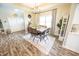 Charming dining area with a wood table and adjacent white closet doors, blending style and functionality at 7895 E 175 N, Franklin, IN 46131