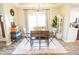 Cozy dining area features a wooden table, elegant rug, and neutral decor, perfect for intimate gatherings at 7895 E 175 N, Franklin, IN 46131
