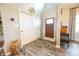 Welcoming entryway with stylish flooring, closet space, and a beautifully stained wooden door at 7895 E 175 N, Franklin, IN 46131