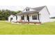 Beautiful house exterior featuring a brick porch with black accents and landscaped yard at 7895 E 175 N, Franklin, IN 46131