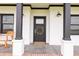 Detailed view of the front door adorned with a wreath, complemented by stylish black accents at 7895 E 175 N, Franklin, IN 46131