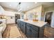 Gourmet kitchen with a large island, stainless steel appliances, and stylish lighting, perfect for culinary enthusiasts at 7895 E 175 N, Franklin, IN 46131