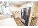 Modern kitchen with stainless steel appliances, white cabinetry, and a spacious island, offering both style and convenience at 7895 E 175 N, Franklin, IN 46131