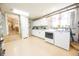 The spacious laundry room features front loading washer and dryer with white cabinets and lots of counter space at 7895 E 175 N, Franklin, IN 46131
