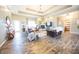 Bright and airy living room with hardwood floors, a cozy fireplace, and comfortable seating at 7895 E 175 N, Franklin, IN 46131