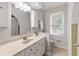 Bathroom featuring a cabinet with a sink and a window with blinds at 8029 Castle Lake Rd, Indianapolis, IN 46256