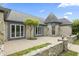 Elegant stone home featuring a unique turret entrance and well-maintained landscaping at 8029 Castle Lake Rd, Indianapolis, IN 46256