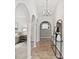Inviting hallway with classic arches, decorative columns, and stylish console table at 8029 Castle Lake Rd, Indianapolis, IN 46256