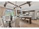 A kitchen featuring a dining table, stools at the bar, and access to the patio via sliding glass doors at 8029 Castle Lake Rd, Indianapolis, IN 46256