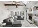 Inviting living room with vaulted ceilings, stone fireplace, and comfortable sectional sofa at 8029 Castle Lake Rd, Indianapolis, IN 46256