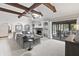 Spacious living room with vaulted ceilings, stone fireplace, and seamless indoor-outdoor flow at 8029 Castle Lake Rd, Indianapolis, IN 46256