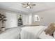 The main bedroom is decorated with art, a bench, and a decorative plant at 8029 Castle Lake Rd, Indianapolis, IN 46256