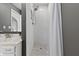 Bathroom shower features white subway tile, a decorative tile floor, and a chrome shower head at 8029 Castle Lake Rd, Indianapolis, IN 46256