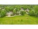 Aerial view of neighborhood, featuring mature trees, well-kept lawns and many houses at 9054 Cinnebar Dr, Indianapolis, IN 46268