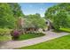 Aerial shot of the property showing mature trees, updated roof and driveway access at 9054 Cinnebar Dr, Indianapolis, IN 46268