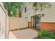 A nice back patio, adjacent to the house, and enclosed with a white wooden fence at 9054 Cinnebar Dr, Indianapolis, IN 46268