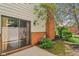 Back patio features sliding glass doors and brick accents that enhance the home's exterior at 9054 Cinnebar Dr, Indianapolis, IN 46268