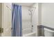 Bathroom with tub shower combo and tiled walls at 9054 Cinnebar Dr, Indianapolis, IN 46268
