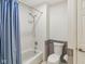 Bathroom with tub shower combo and tiled walls at 9054 Cinnebar Dr, Indianapolis, IN 46268