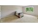 Bedroom with a large window letting in natural light and carpet floors at 9054 Cinnebar Dr, Indianapolis, IN 46268