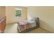Neutral bedroom with a window providing natural light and a cozy bed at 9054 Cinnebar Dr, Indianapolis, IN 46268