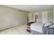 Large carpeted bedroom with ample lighting and doorways at 9054 Cinnebar Dr, Indianapolis, IN 46268
