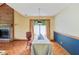 Bright dining room with hardwood floors and a sliding glass door to the backyard at 9054 Cinnebar Dr, Indianapolis, IN 46268