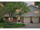 Charming home exterior with brick accents, a well-kept lawn, and a welcoming front porch at 9054 Cinnebar Dr, Indianapolis, IN 46268
