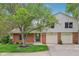 Charming home featuring a well-manicured lawn and attached two-car garage at 9054 Cinnebar Dr, Indianapolis, IN 46268