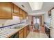 Kitchen with tile counters open to the dining area and featuring lots of natural light at 9054 Cinnebar Dr, Indianapolis, IN 46268