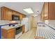 Functional kitchen with tile countertops, white appliances, and ample cabinet space at 9054 Cinnebar Dr, Indianapolis, IN 46268
