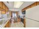 Kitchen with tile counters open to the dining area and featuring lots of natural light at 9054 Cinnebar Dr, Indianapolis, IN 46268