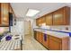 Functional kitchen with tile countertops, white appliances, and plentiful storage at 9054 Cinnebar Dr, Indianapolis, IN 46268