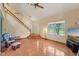 Bright living room with vaulted ceiling, hardwood floors, and staircase to the second floor at 9054 Cinnebar Dr, Indianapolis, IN 46268