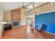 Spacious living room with hardwood floors, brick fireplace, and an open layout at 9054 Cinnebar Dr, Indianapolis, IN 46268