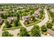 Aerial view of a well-planned community featuring lush greenery, mature trees, and well-maintained homes at 9311 Windrift Way, Zionsville, IN 46077