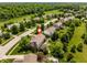 Aerial view of a home with a basketball hoop and lush yard near a community with mature trees at 9311 Windrift Way, Zionsville, IN 46077