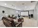 Finished basement with comfortable leather furniture and large screen at 9311 Windrift Way, Zionsville, IN 46077