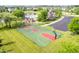 Community basketball court with mature trees and proximity to the community pool at 9311 Windrift Way, Zionsville, IN 46077