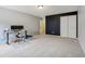 Spacious bedroom features neutral carpet and dark accent wall and adjacent closet at 9311 Windrift Way, Zionsville, IN 46077