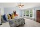 Bedroom showcasing a vaulted ceiling, neutral walls, and bright natural light at 9311 Windrift Way, Zionsville, IN 46077
